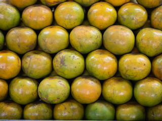 A lot of orange piles in a basket.