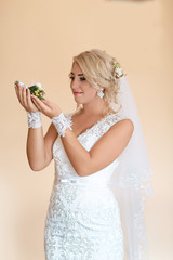 Fototapeta na wymiar Beautiful bride portrait with flowers in her hand, selective focus