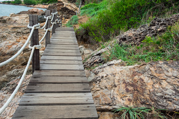 landscape beach bridge near sea with beautiful nature rocks and grass