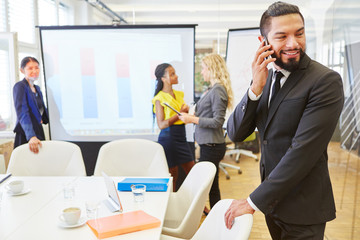Businessman calling with smartphone