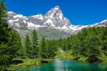 Beautiful landscape with the Matterhorn (Cervino) and another Matterhorn (Cervino) reflected on the Blue Lake (Lago Blu) near Breuil-Cervinia, Aosta, Italy