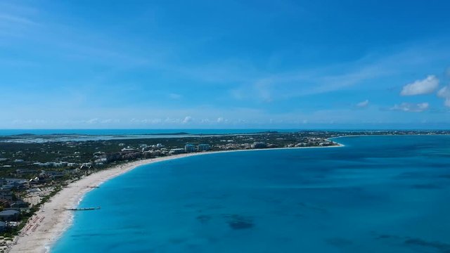Drone panning aerial of pier in Grace Bay, Providenciales, Turks and Caicos