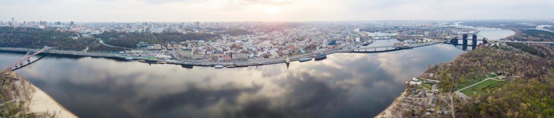 Fototapeta premium panorama of the left part of the city of Kyiv across the Dnieper river with bridges