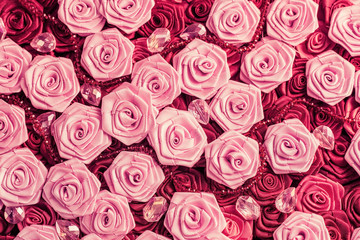 Wedding background with red and light pink silky roses, decoration of the wedding party, delicate bride and bridesmaids texture