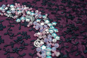 Moon and stars bead embroidery on fabric, fashion background