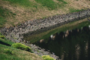 The beautiful picture at the edge of a lake, and huge boulder in this lake