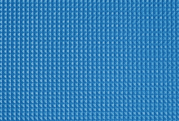 Square pattern of soft plastic mat. Closeup.