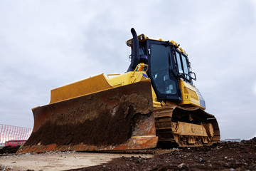 Bulldozer at construction site © Norman01