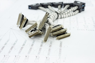 A bundle of cable harnesses lies on the table.