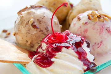 A sweet and tasty ice cream with whipped cream and sauce