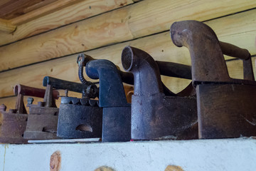 Old clother irons are decoration of old house