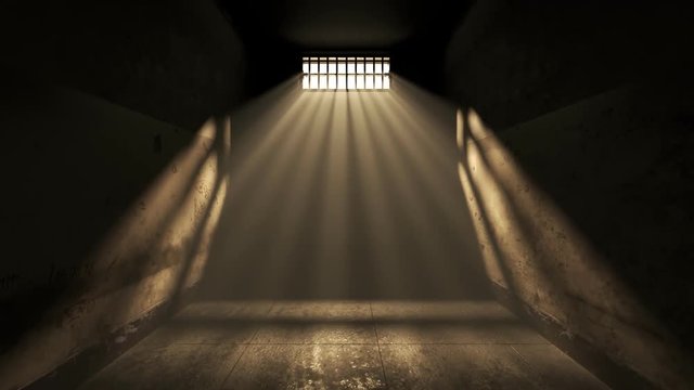 Dark old cell interior with barred up window. Sun rays coming through the fog.