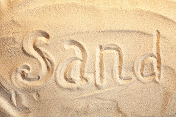 Beach sand with word