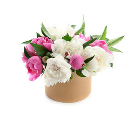 Box with beautiful peony flowers on white background