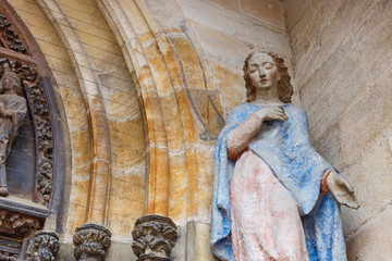 madonna figure on ancient church wall