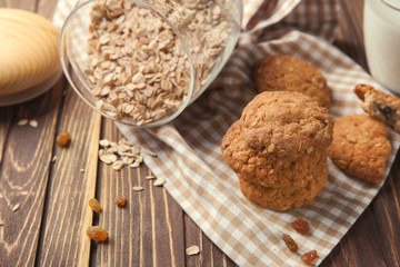 Delicious cookies with oatmeal on wooden table