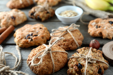 Delicious oatmeal cookies on wooden background