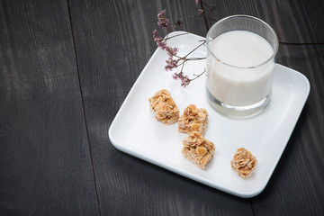 Milk glass on wooden table. Healthy eating concept