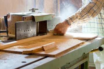 Carpenter tools on wooden table with sawdust. Circular Saw. Cutting a wooden plank