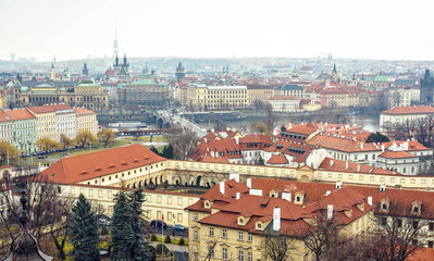 Naklejka na ściany i meble Cloudy day aerial view to clay pot roofs of Prague