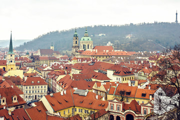 Fototapeta na wymiar Cloudy day aerial view to clay pot roofs of Prague