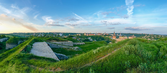 Kamianets-Podilskyi view with stone-earthen fortifications on foreground, Ukraine