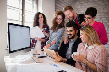 Group of young architects using digital tablet
