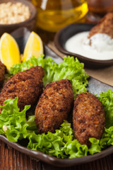 Traditional arabic kibbeh with lamb and pine nuts.