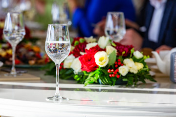 A beautiful banquet table with snacks and flowers on the table. Selective focus