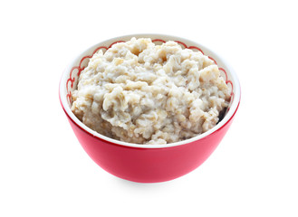 Tasty oatmeal in bowl on white background