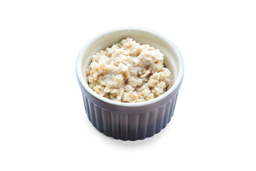 Tasty oatmeal in bowl on white background