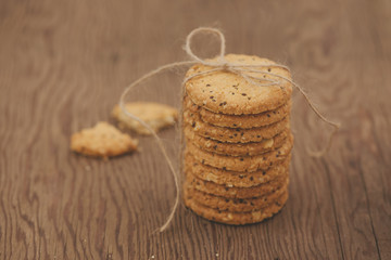 Still life of freshly baked chocolate chip cookies on plate on table.