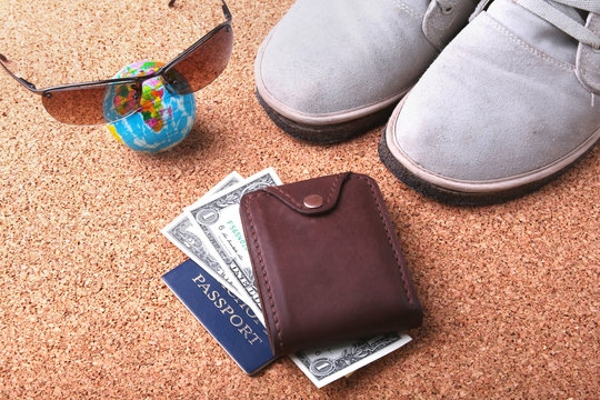 Set of men's accessories for the tourist on a white wooden background. The concept of fashion, leisure and travel.