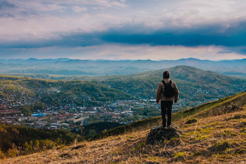 My country, my home. Man on top of mountain massif. Idyllic evening - a man on the ridge of the Low Tatras at sunset. Self Portrait in a mountain area.