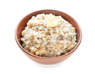 Bowl with tasty oatmeal on white background
