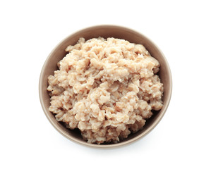 Bowl with prepared oatmeal on white background