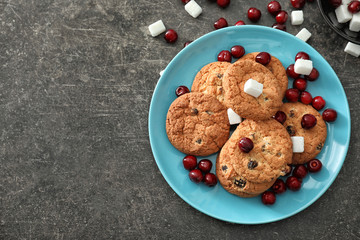 Delicious cookies with cherries on plate
