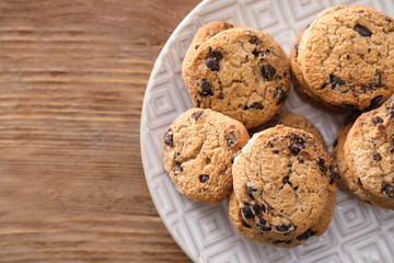 Delicious cookies with chocolate chips on plate