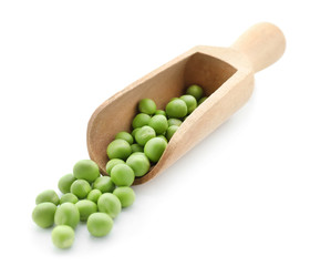 Scoop with fresh green peas on white background