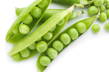 Pods with fresh green peas on white background