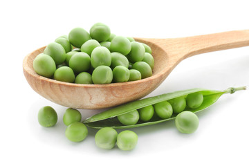 Spoon with fresh green peas on white background, closeup