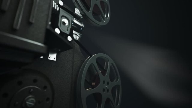 Vintage projector on the dark background. A retro device using old technology.
