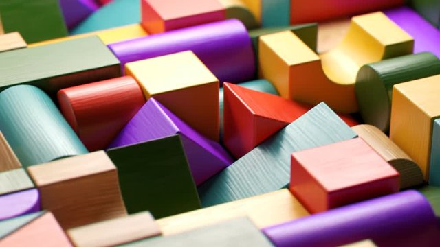Multicolored wooden blocks toy laid down in the endless pattern. Preschool game.