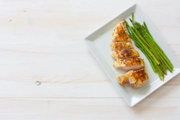 Grilled chicken fillet and asparagus