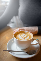 coffee cup. woman in cafe.