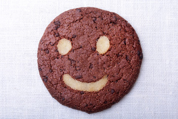 Homemade oatmeal cookies in wicker basket on old table background. Healthy Food Snack Concept. Copy space.