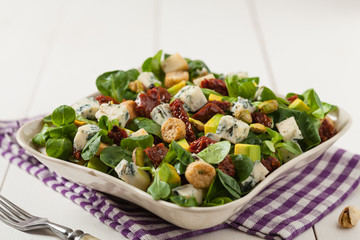 Italian salad with avocado, gorgonzola cheese.