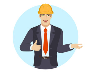 Businessman in construction helmet gesticulating and showing thumb up