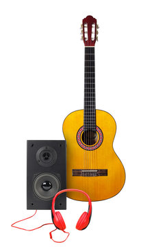 Music and sound - Classic guitar, loudspeaker enclosure and red headphone. Isolated
