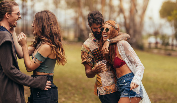 Hippie friends having a great time at music festival
